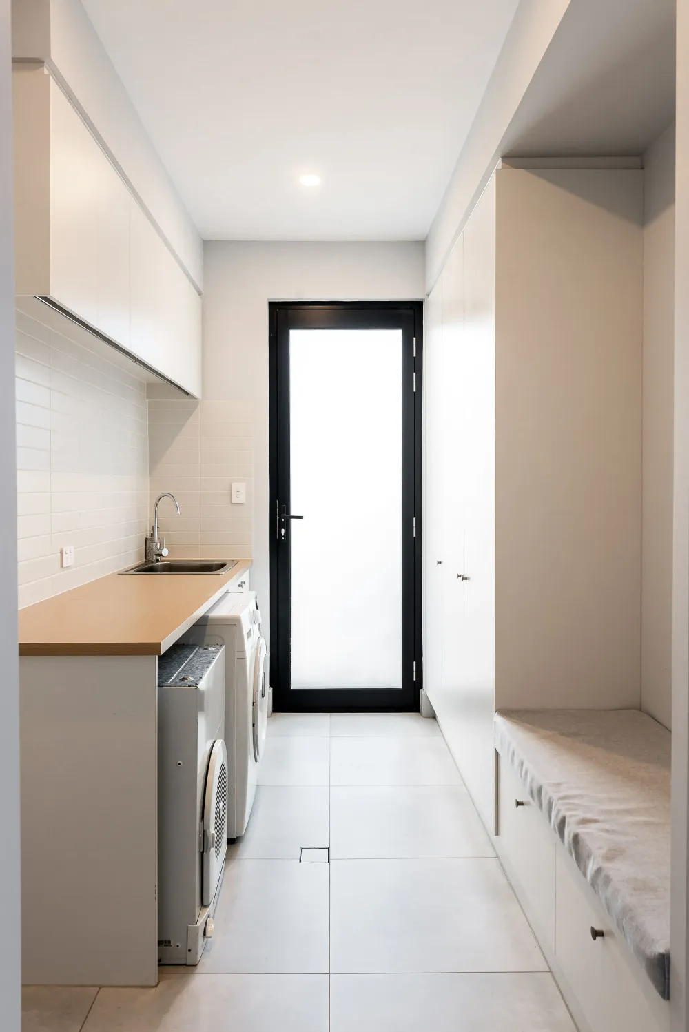 Shower with brass fixtures and stone tiling